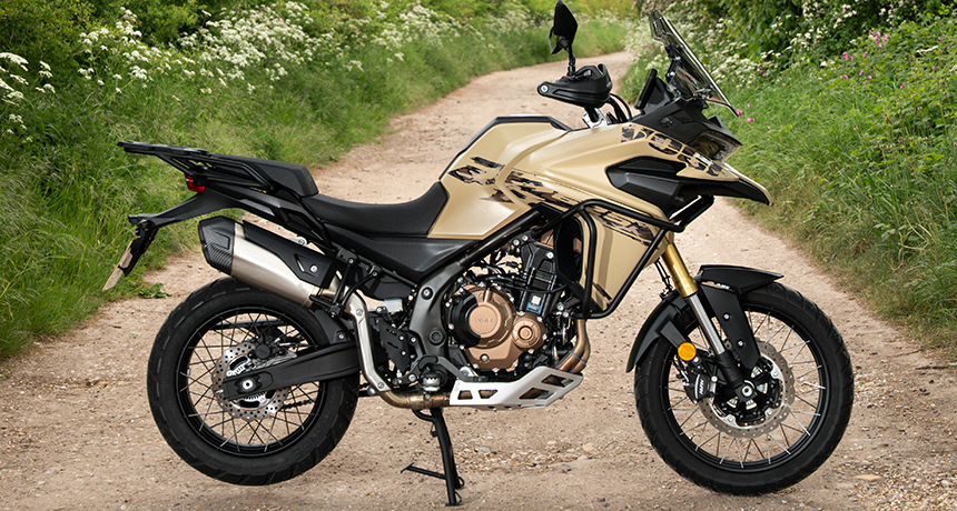 A side-on photo of a Voge DS625X on a country lane