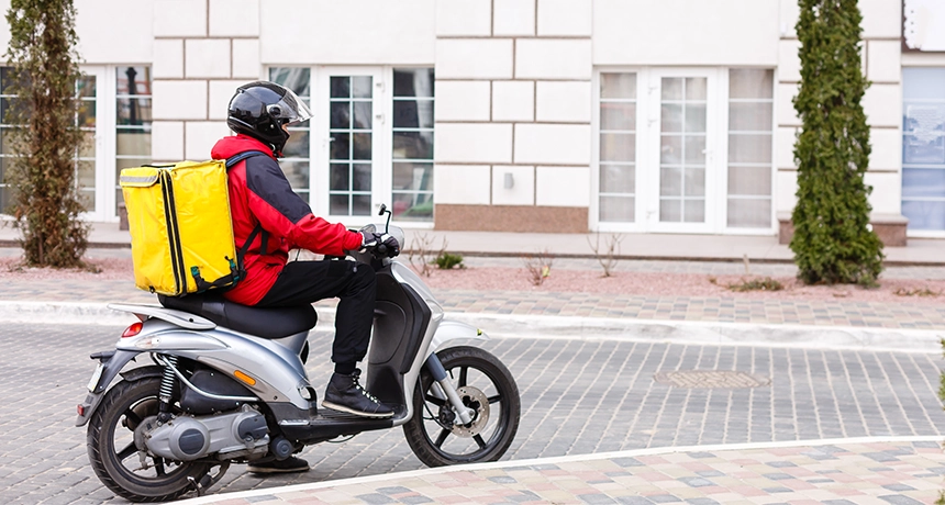 Delivery rider on motorbike