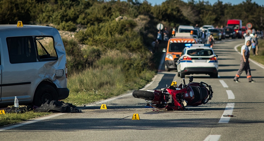 crashed motorbike busy road