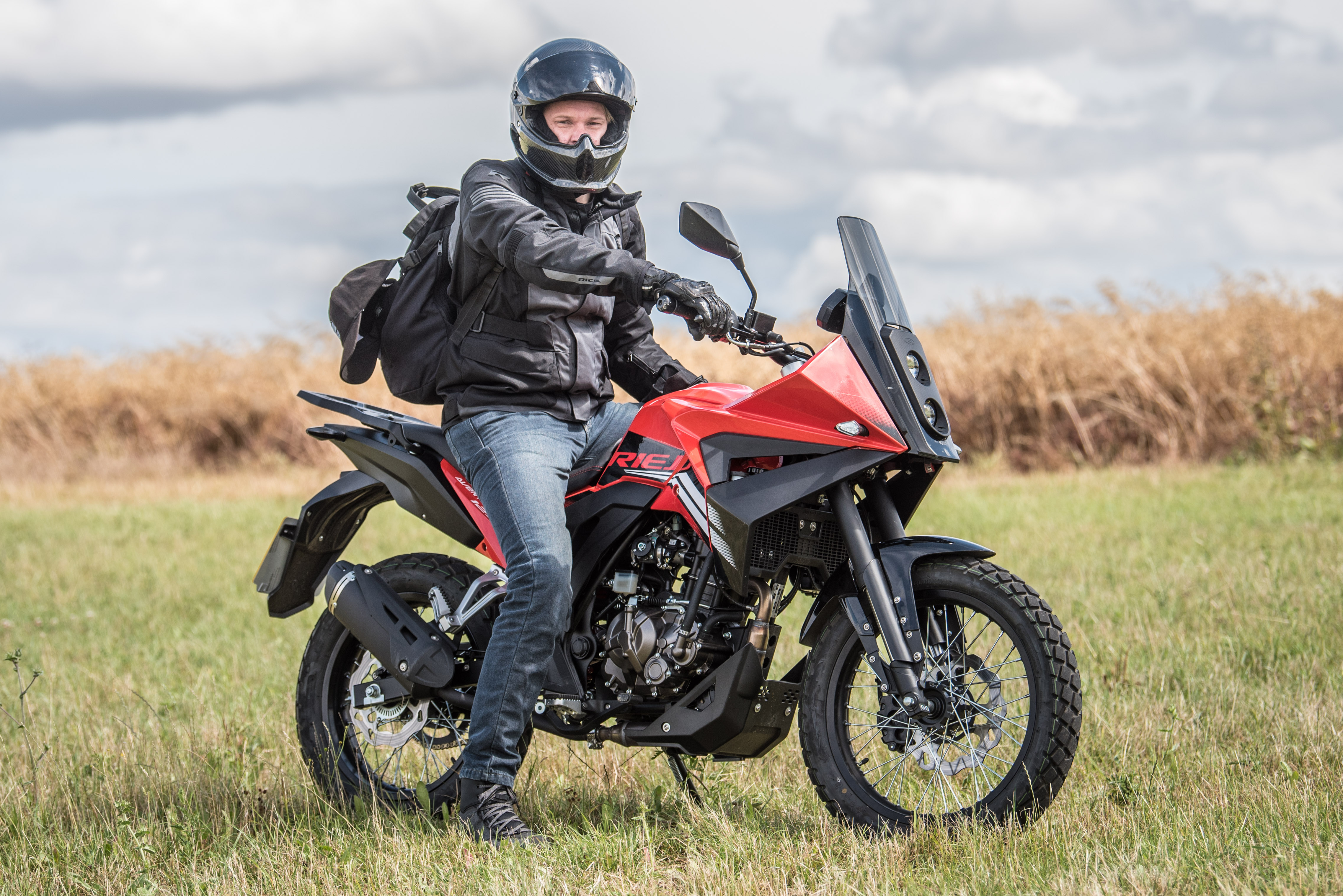 Alex on the 2023 Rieju Aventura 125 in a field