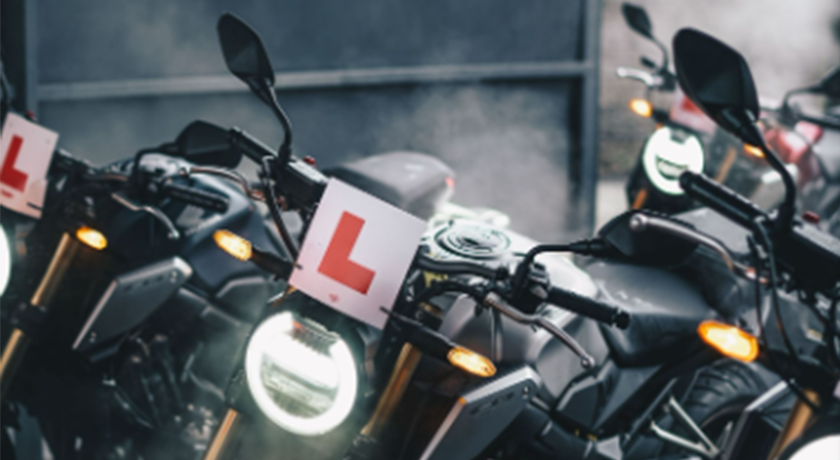 Parked motorbikes with learner plates