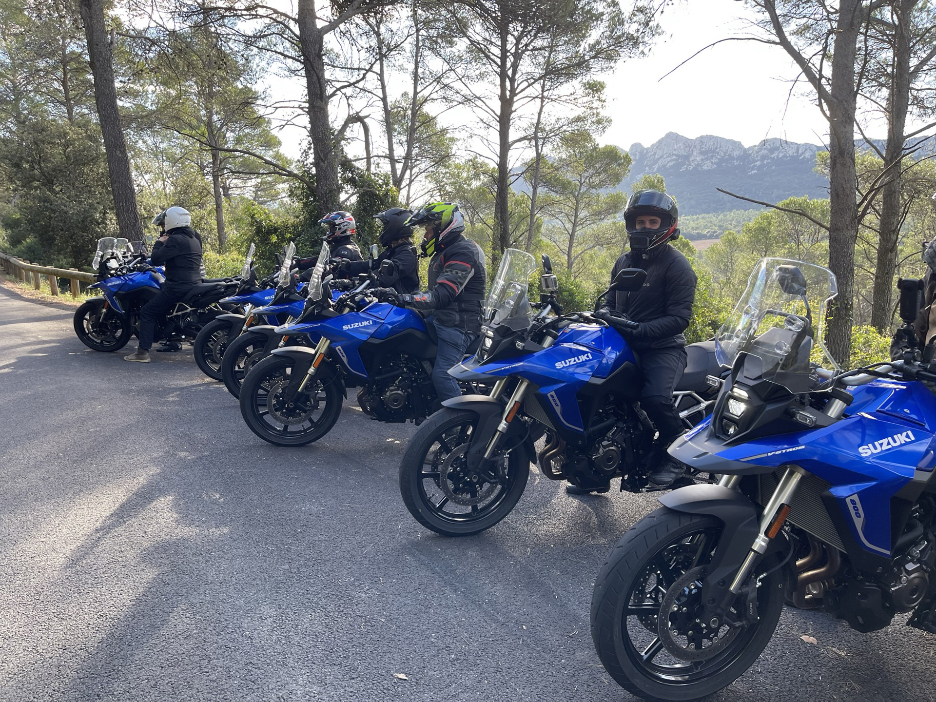 Motorcycle riders with the blue Suzuki V-Strom 800RE