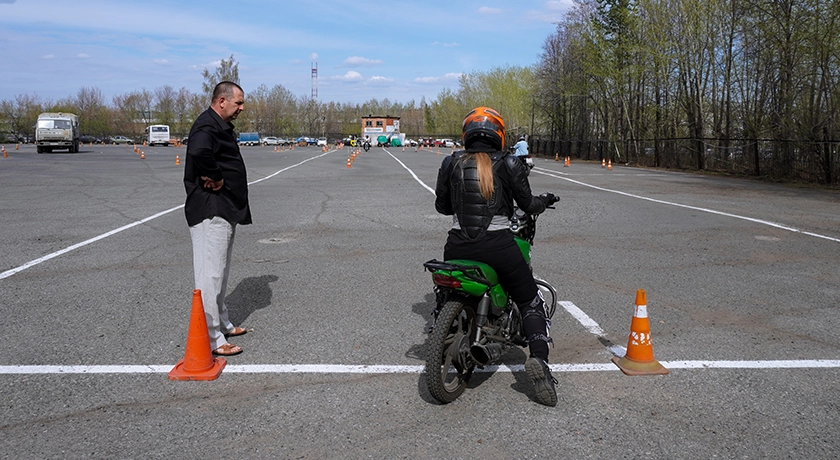 Learner rider with instructor.webp