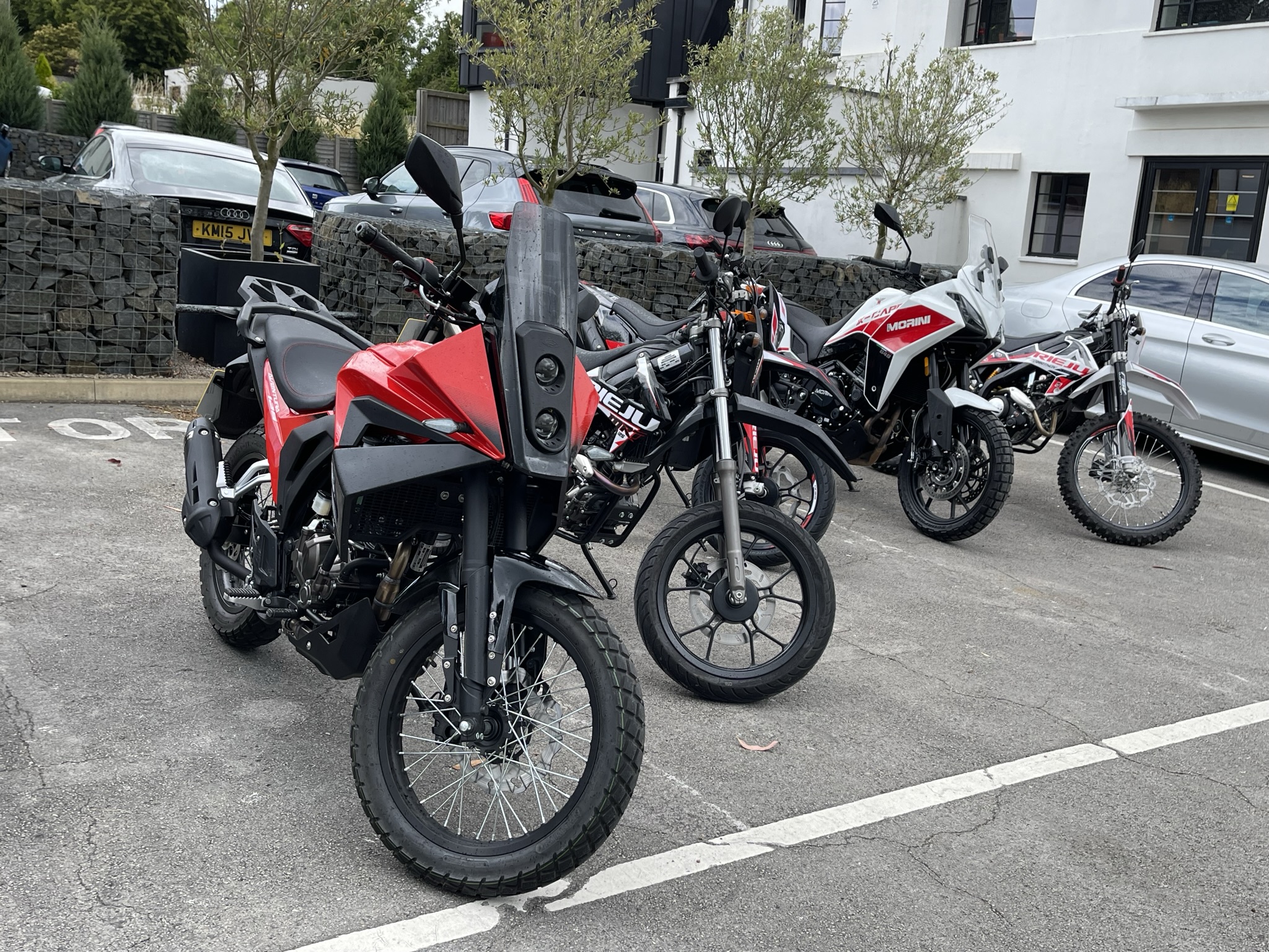 Some of the Moto Mondo lineup, including Rieju Aventura 125, Rieju Marathon 125 SM, Moto Morini X-Cape