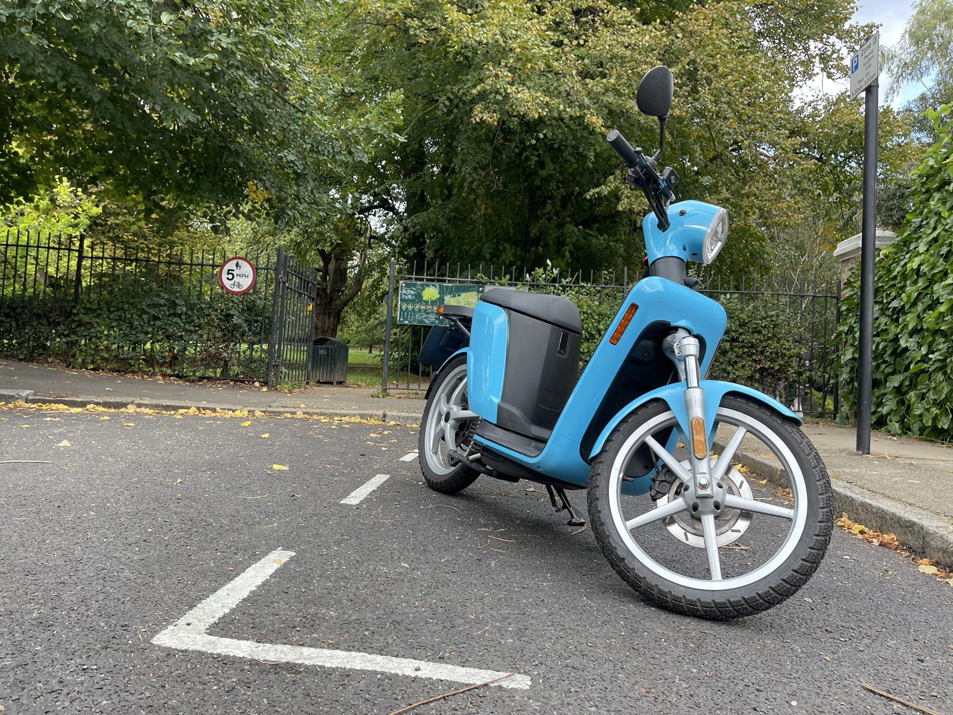 Electric scooter Askoll eSpro 70 in blue with park in background