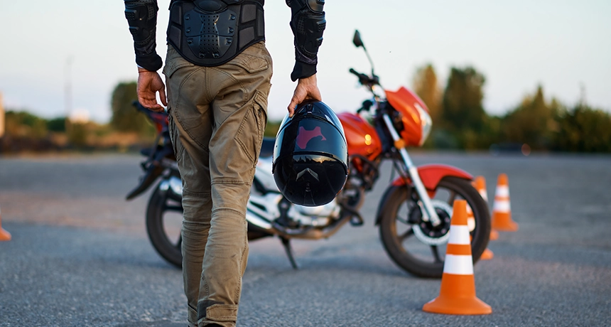 person walking towards motorbike