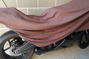 Motorcycle maintenance storage and cover