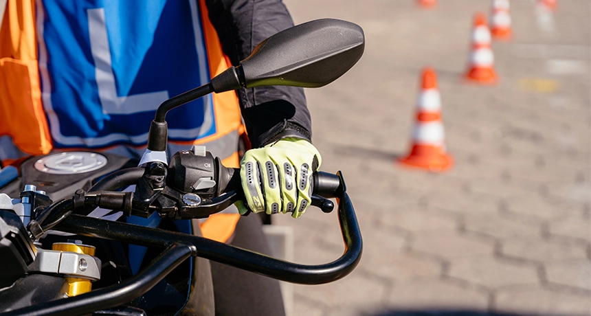 hand holding motorbike