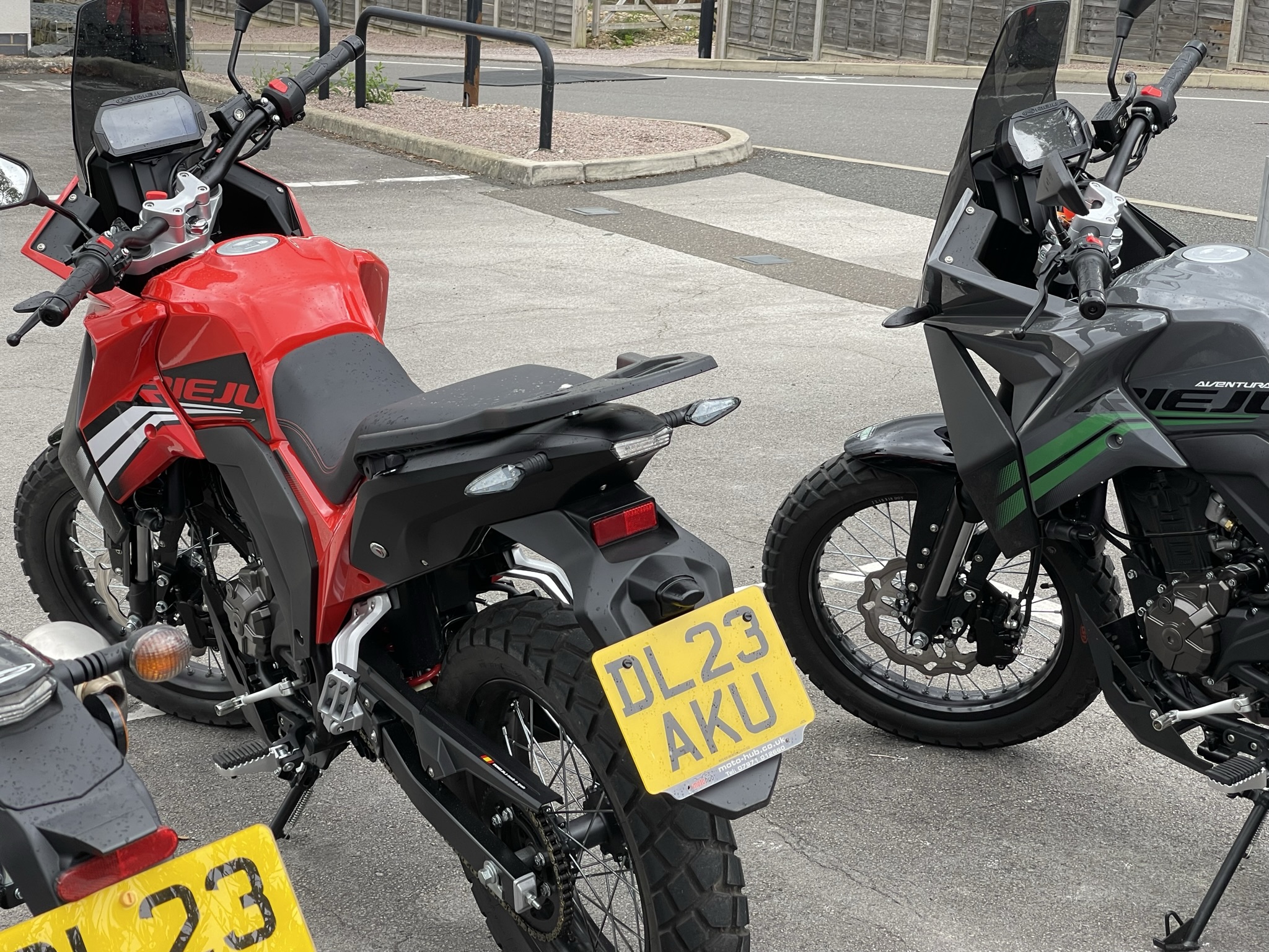 Rieju Aventura 125 in red and grey and green from the rear